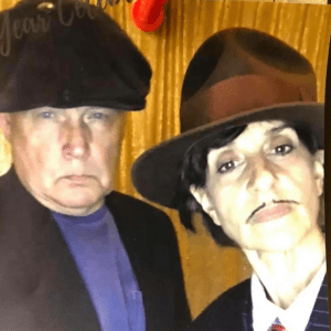 man and woman in hat